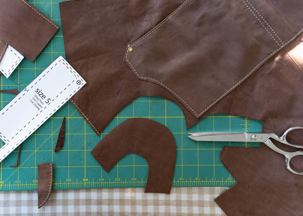 thrifted scrap leather being upcycled into leather baby shoes