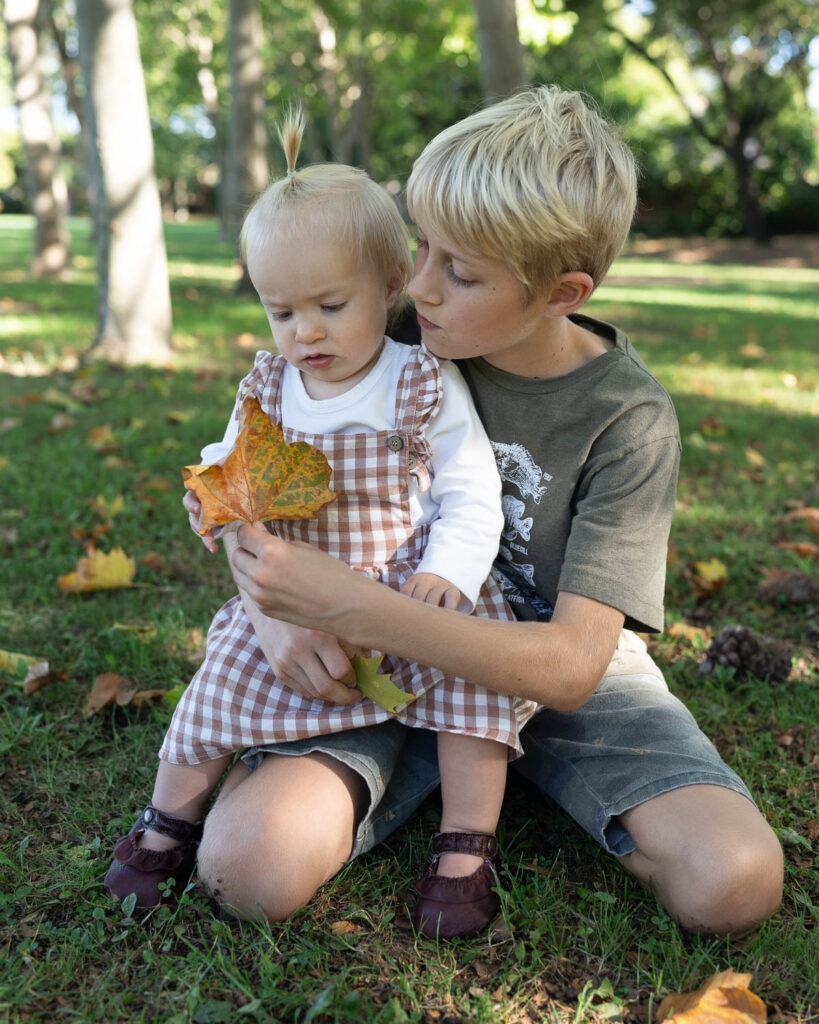 a baby wearing handmade leather shoes