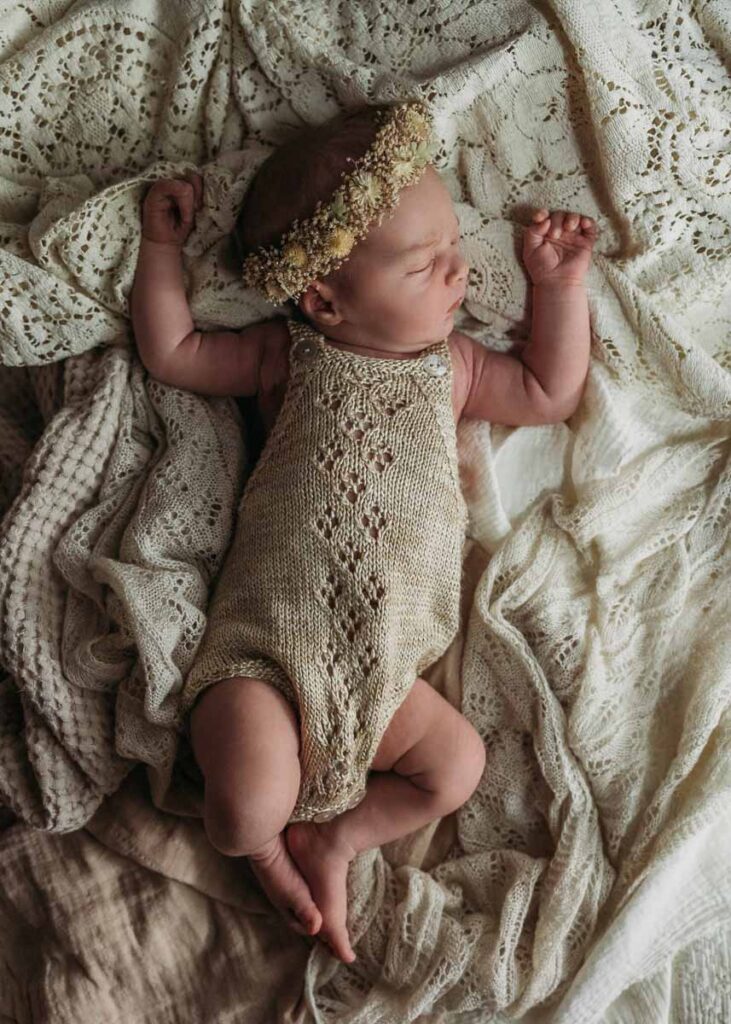 Lacey Romper knitting pattern to make for a baby girl