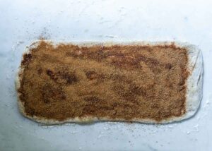 sourdough rolled out and sprinkled with cinnamon and sugar