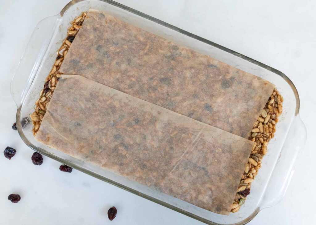 a baking dish with healthy homemade granola bars