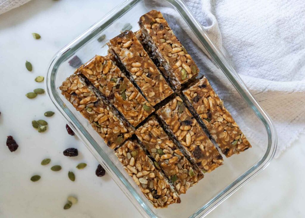 a glass container with healthy homemade granola bars
