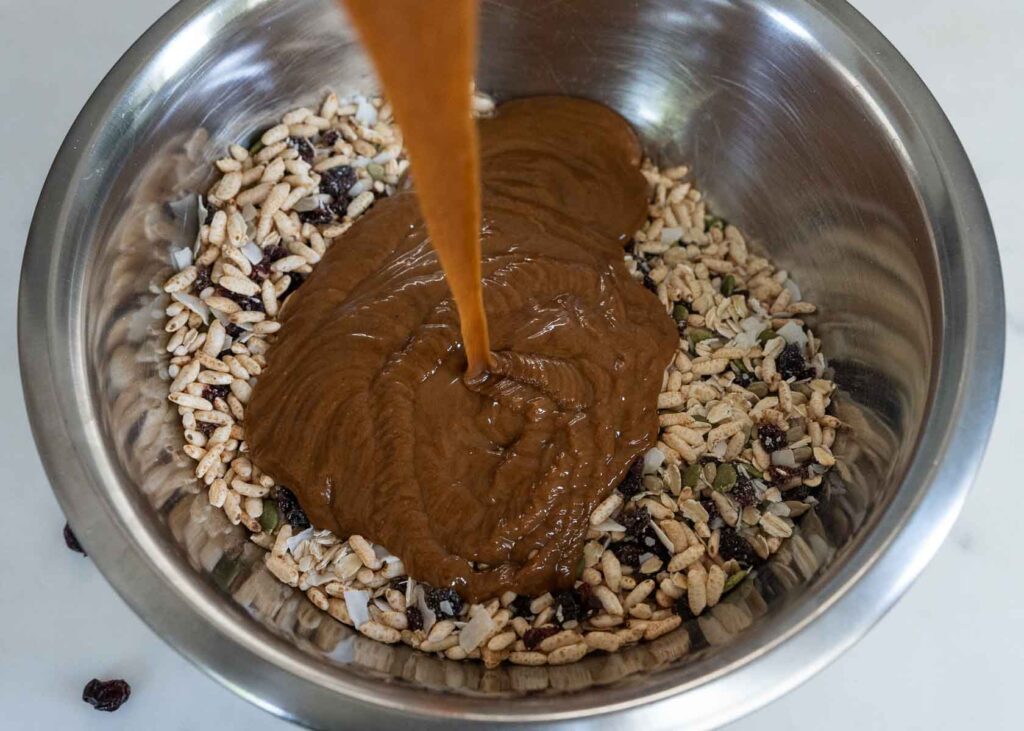 a bowl of ingredients for healthy homemade granola bars