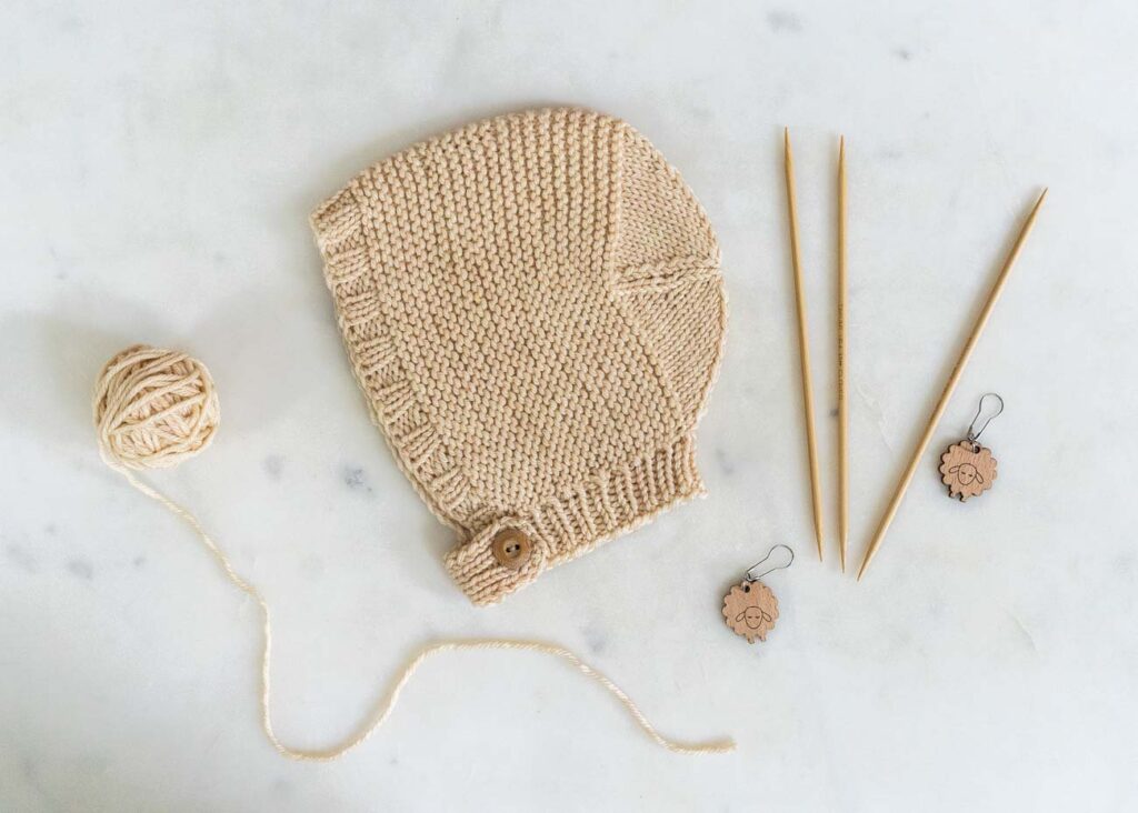 knitting a bonnet for a baby girl