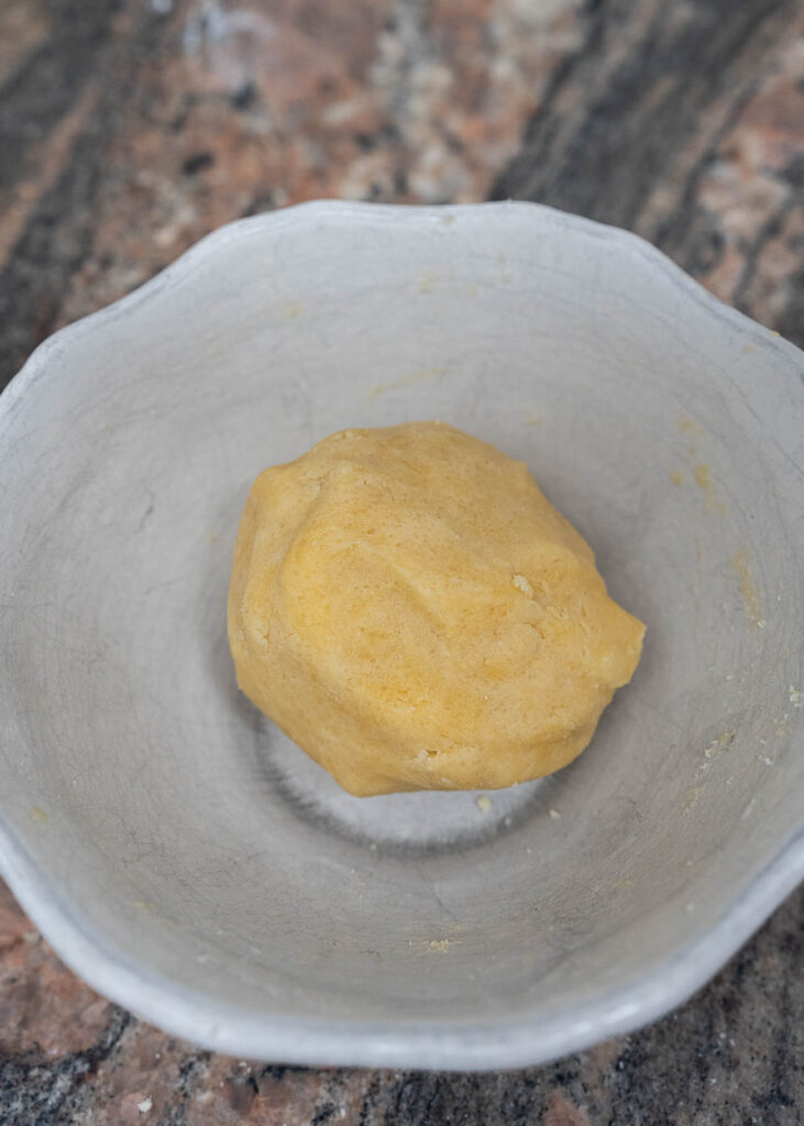 a ball of dough for cheesecake crust